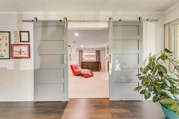 a bedroom with furniture and a mirror
