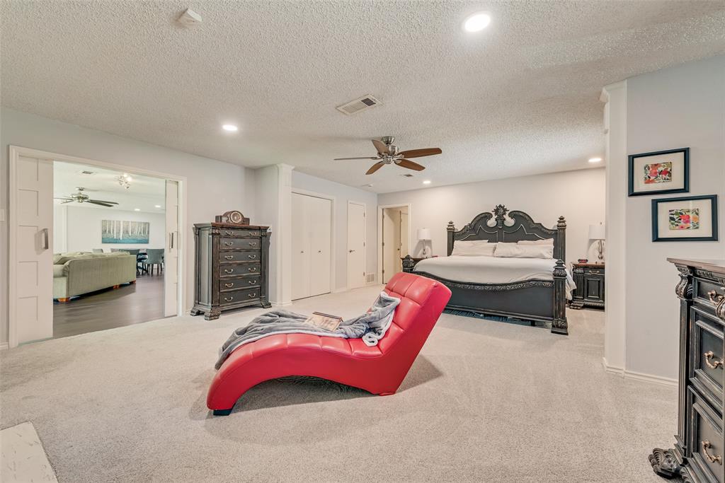 805 Crowley Road Arlington, TX 76012 - Photo 19 of 30 a bedroom with furniture and a mirror