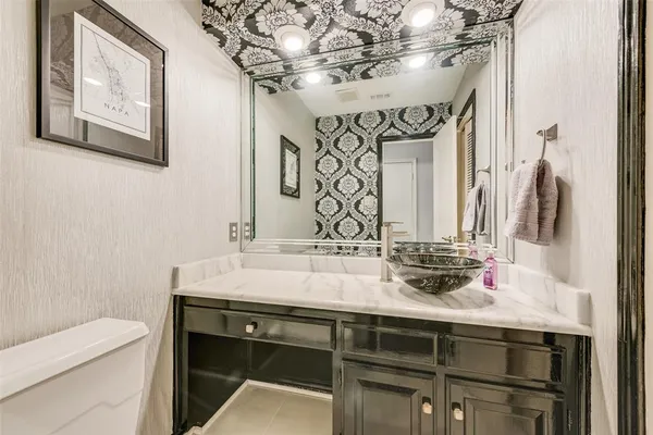 a bathroom with a sink double vanity and a mirror