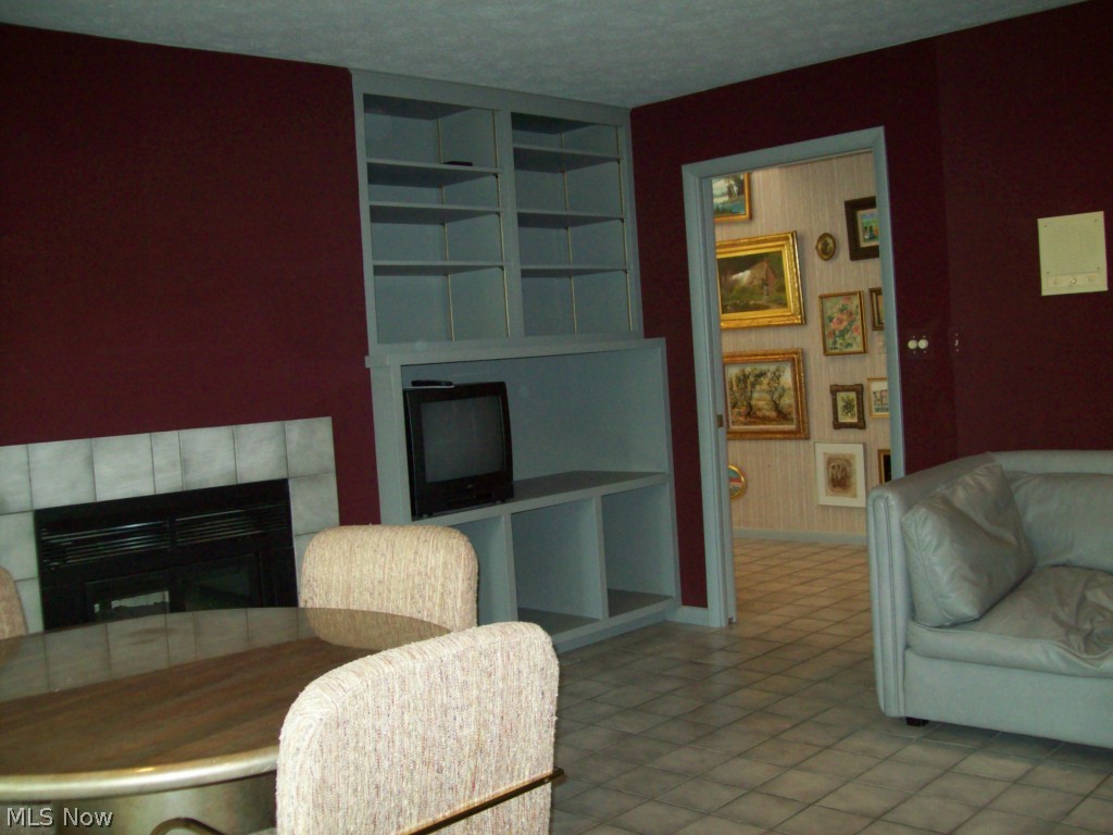 3883-2 Lander Road, Unit Q2 Chagrin Falls, OH 44022 - Photo 8 of 22 Another angle of family room w/see thru fireplace to living room, built-ins and a built-in wet bar on other side of fireplace.
