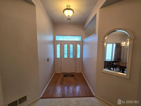 a view of entryway with wooden floor