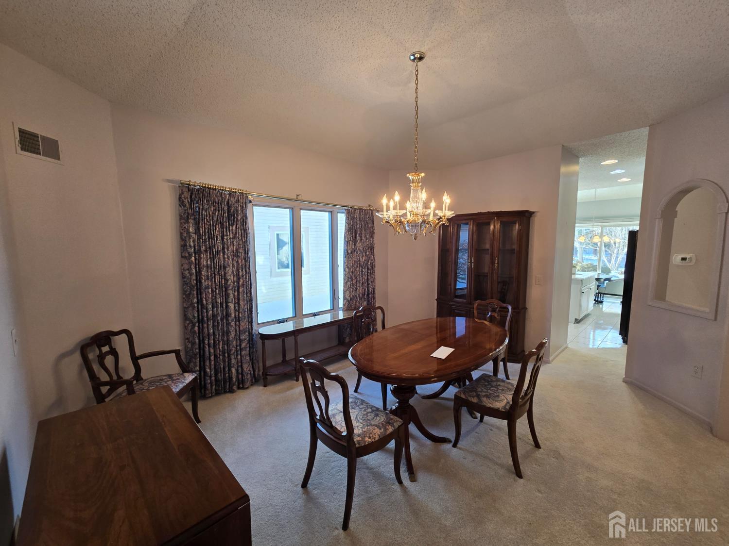 133 Chichester Road Monroe Township, NJ 08831 - Photo 13 of 25 a view of a dining room with furniture and chandelier