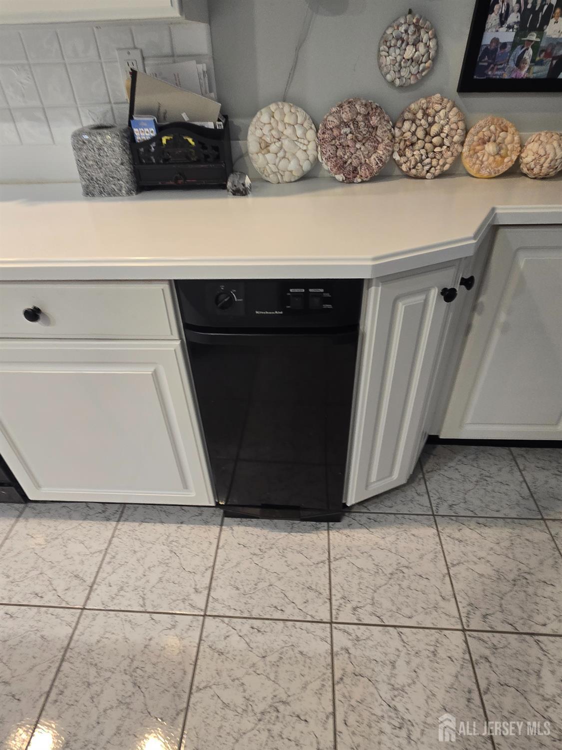 133 Chichester Road Monroe Township, NJ 08831 - Photo 23 of 25 a kitchen with a sink and cabinets