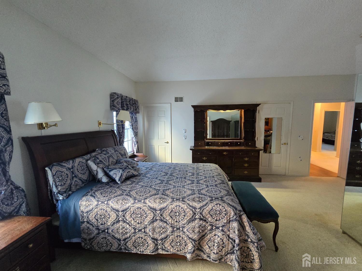 133 Chichester Road Monroe Township, NJ 08831 - Photo 7 of 25 a bedroom with a bed and a television in it