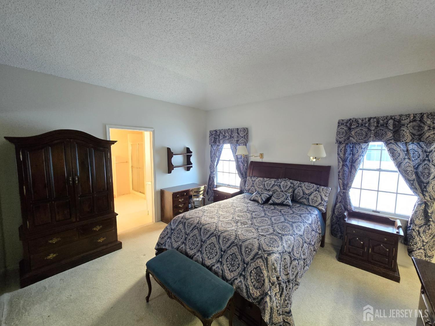 133 Chichester Road Monroe Township, NJ 08831 - Photo 8 of 25 a bedroom with a bed and a dresser next to a window