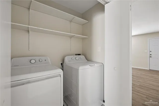 a kitchen with a refrigerator a sink and cabinets