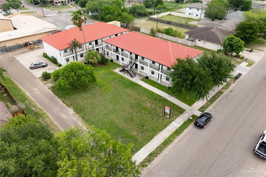 1105 West Stubbs Street, Unit 4 Edinburg, TX 78539 - Photo 3 of 12 an aerial view of a tennis ground and a cars park side of the road