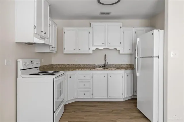 a view of kitchen and wooden floor