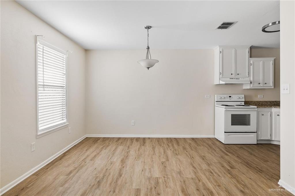1105 West Stubbs Street, Unit 4 Edinburg, TX 78539 - Photo 7 of 12 a view of kitchen and wooden floor