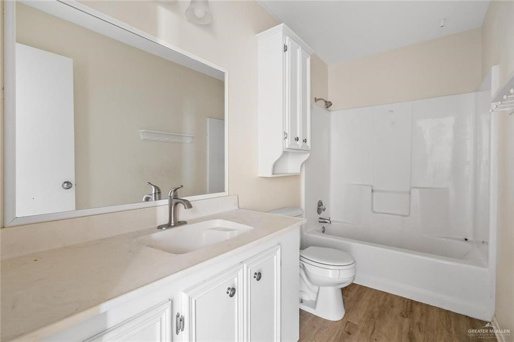 1105 West Stubbs Street, Unit 4 Edinburg, TX 78539 - Photo 10 of 12 a bathroom with a toilet a sink and a bathtub