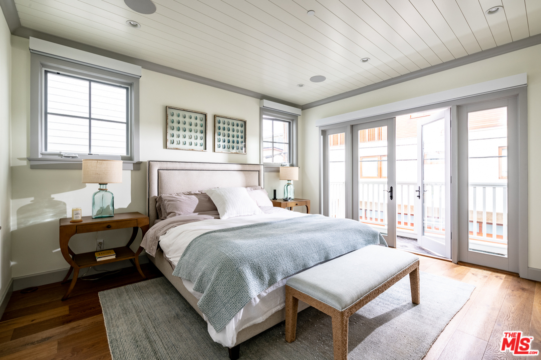 703 Bayview Drive Manhattan Beach, CA 90266 - Photo 11 of 24 a bedroom with a bed and a large window