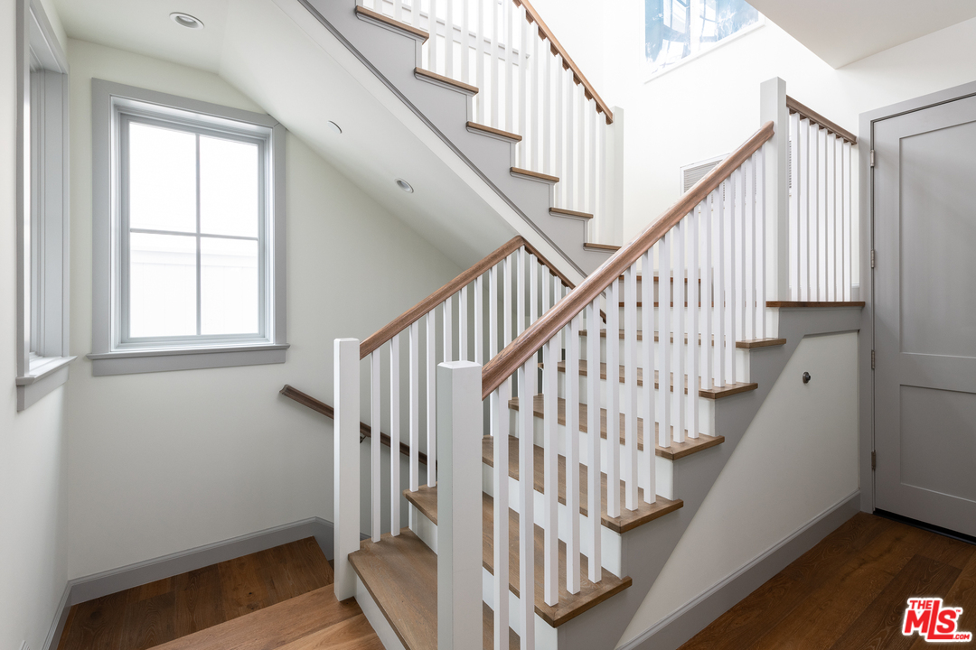 703 Bayview Drive Manhattan Beach, CA 90266 - Photo 13 of 24 a view of staircase with railing and white walls