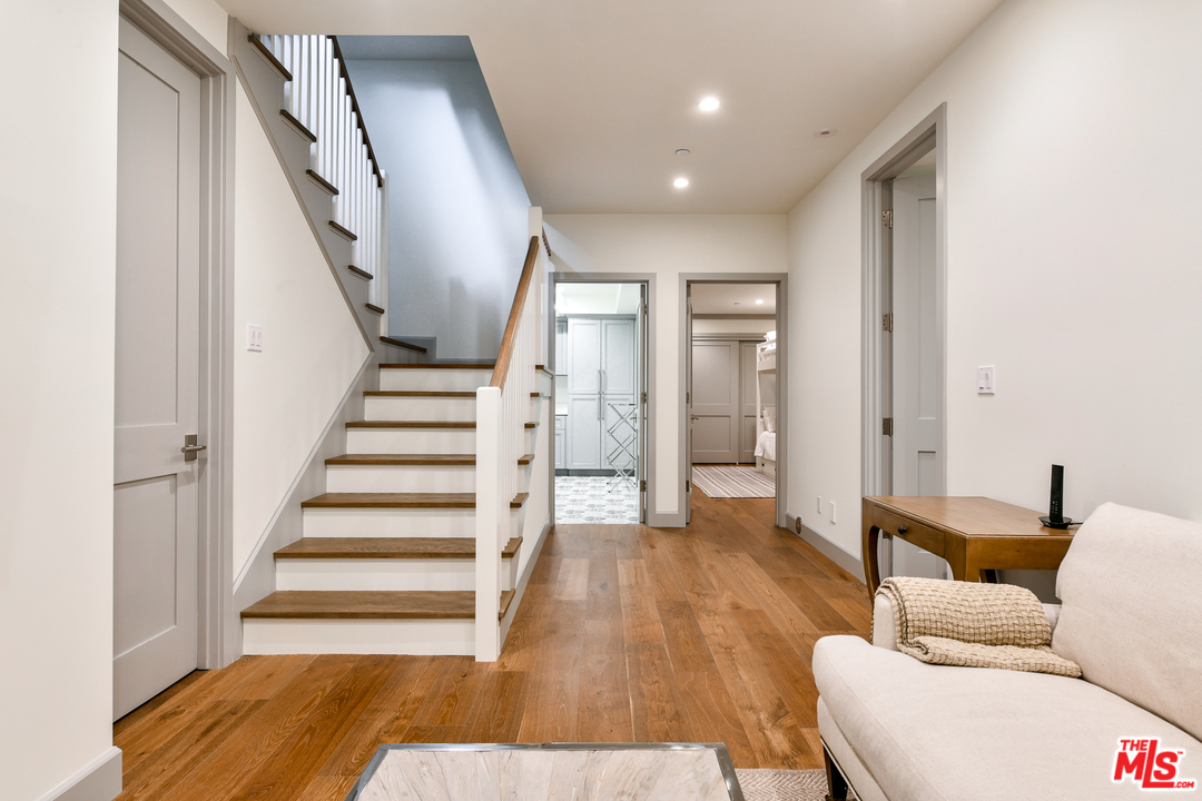703 Bayview Drive Manhattan Beach, CA 90266 - Photo 18 of 24 a living room with furniture and wooden floor