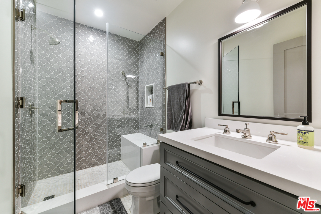 703 Bayview Drive Manhattan Beach, CA 90266 - Photo 23 of 24 a bathroom with a sink toilet and shower
