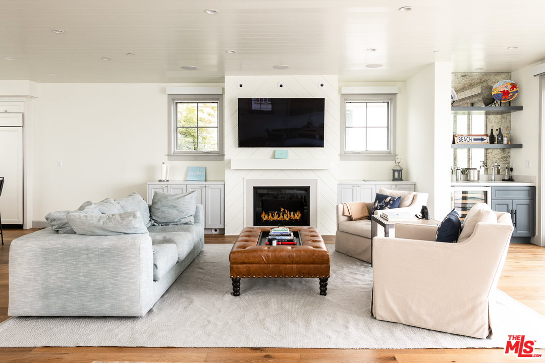 703 Bayview Drive Manhattan Beach, CA 90266 - Photo 8 of 24 a living room with furniture fireplace and a flat screen tv