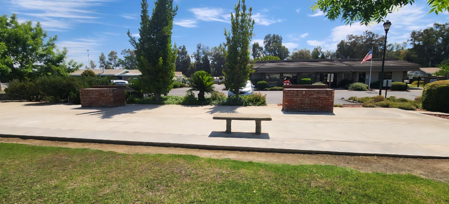 1300 West Olson Avenue, Unit 179 Reedley, CA 93654 - Photo 35 of 39 a view of a backyard with sitting area