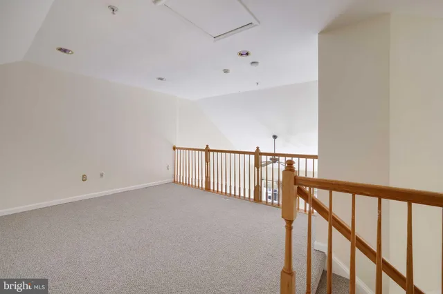 a view of an empty room with stairs
