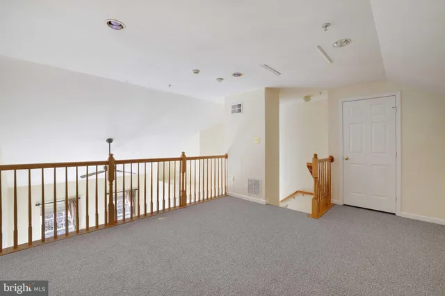a view of a livingroom with stairs