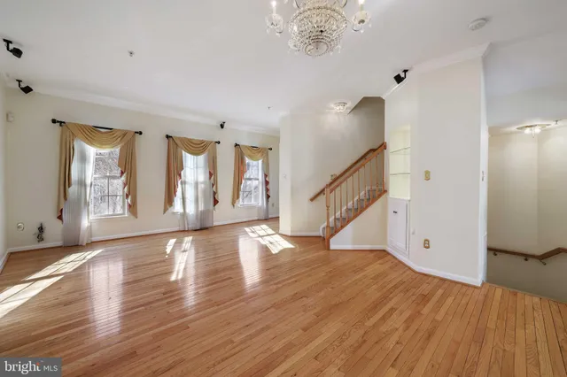 a view of an entryway with wooden floor