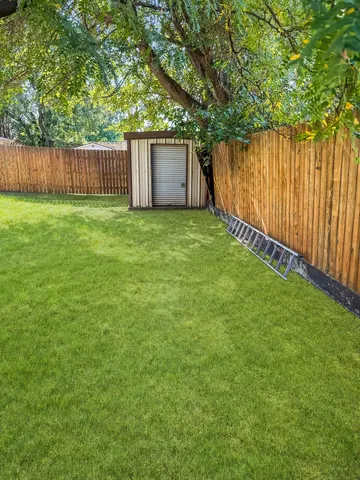 a view of a backyard with a garden