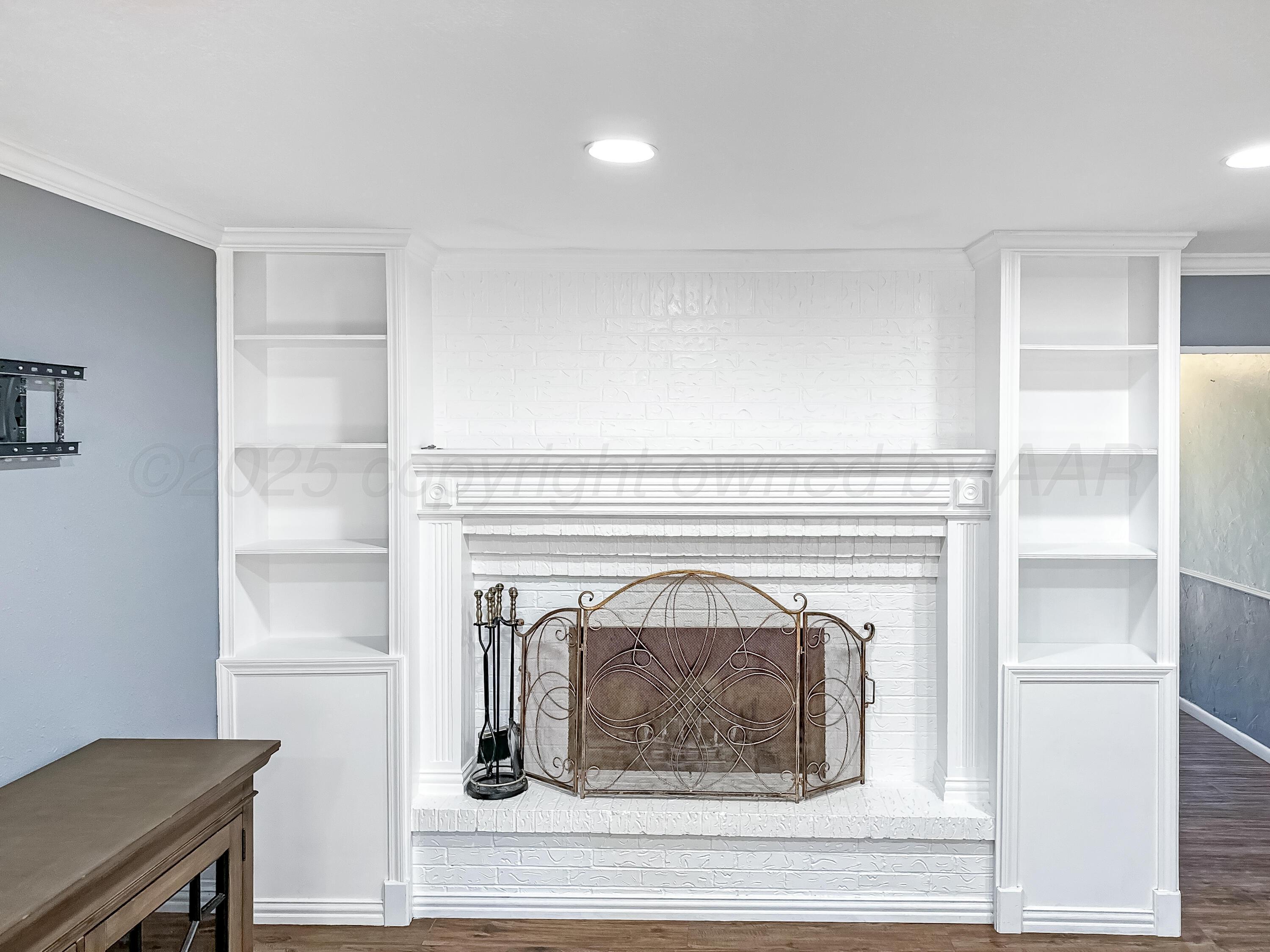 216 Skycrest Street Borger, TX 79007 - Photo 5 of 20 a view of a livingroom with a fireplace