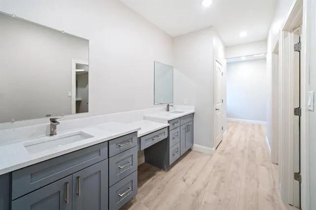 a spacious bathroom with a double vanity sink double vanity and a mirror
