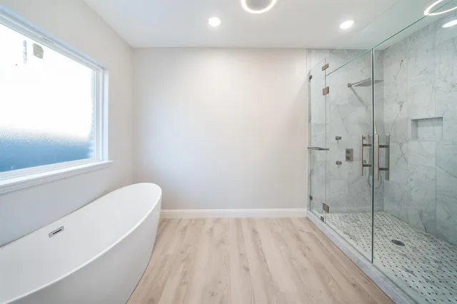 a bathroom with a shower and a toilet