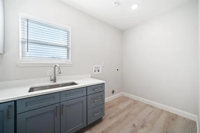 a bathroom with a sink and a window