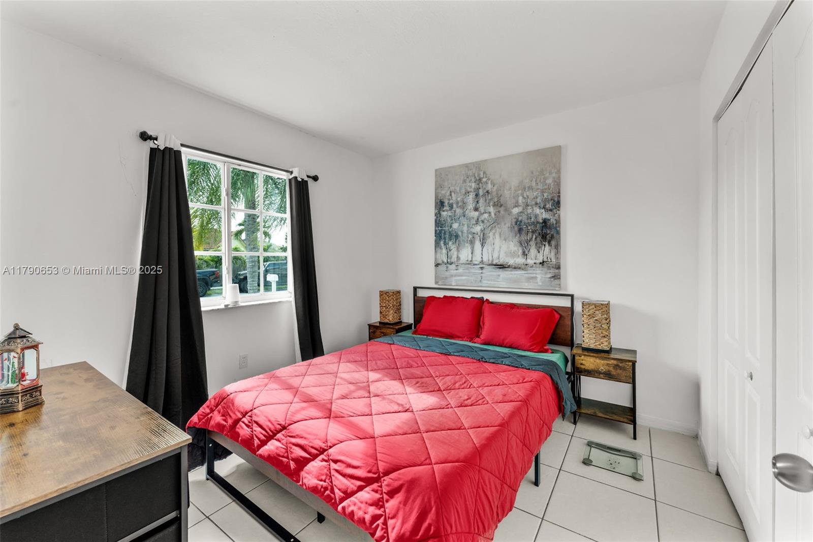 17834 Southwest 144th Court Miami, FL 33177 - Photo 14 of 23 a bedroom with a bed and a table in it