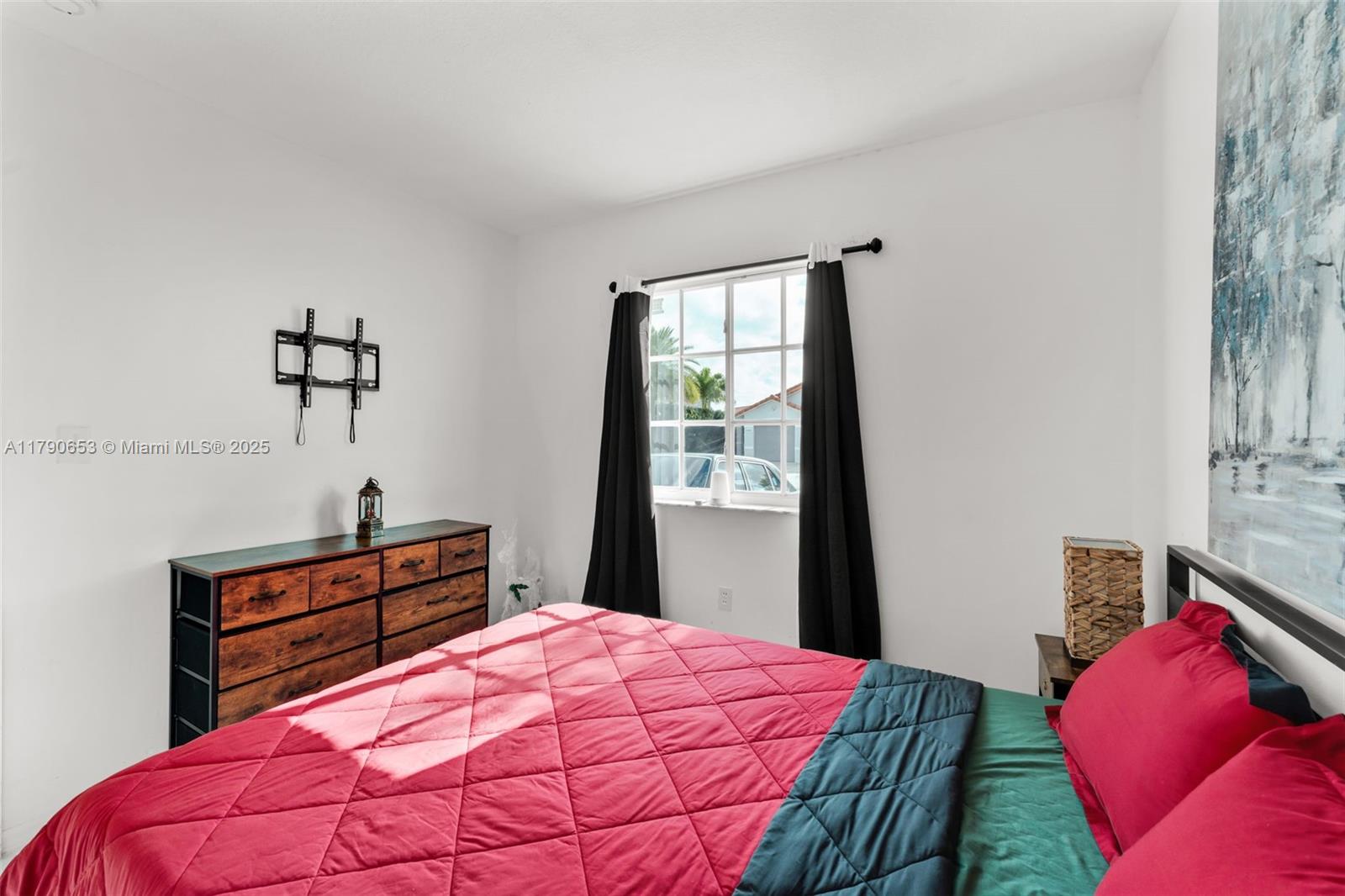 17834 Southwest 144th Court Miami, FL 33177 - Photo 15 of 23 a bedroom with a bed and a window