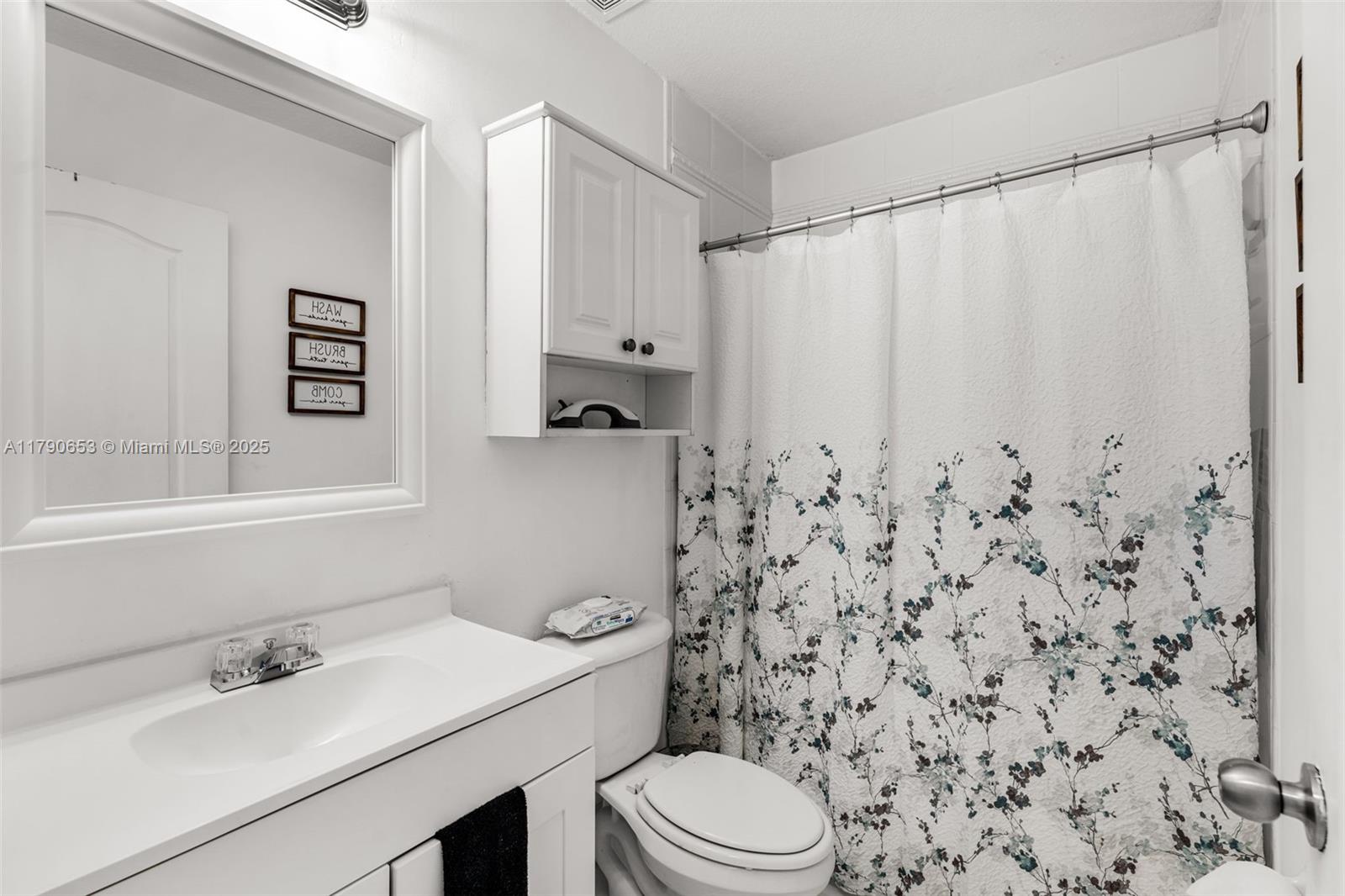 17834 Southwest 144th Court Miami, FL 33177 - Photo 16 of 23 a bathroom with a sink toilet and shower