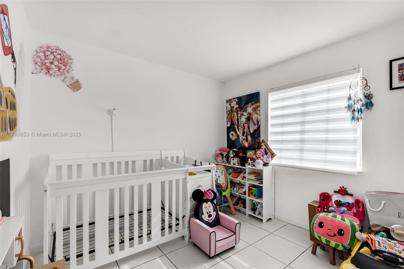 17834 Southwest 144th Court Miami, FL 33177 - Photo 17 of 23 a bedroom with furniture and a window