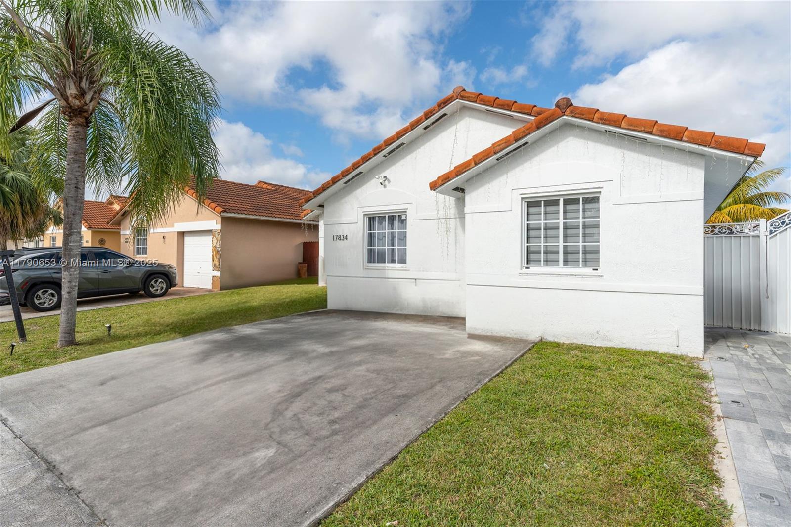 17834 Southwest 144th Court Miami, FL 33177 - Photo 2 of 23 a view of house that has a yard