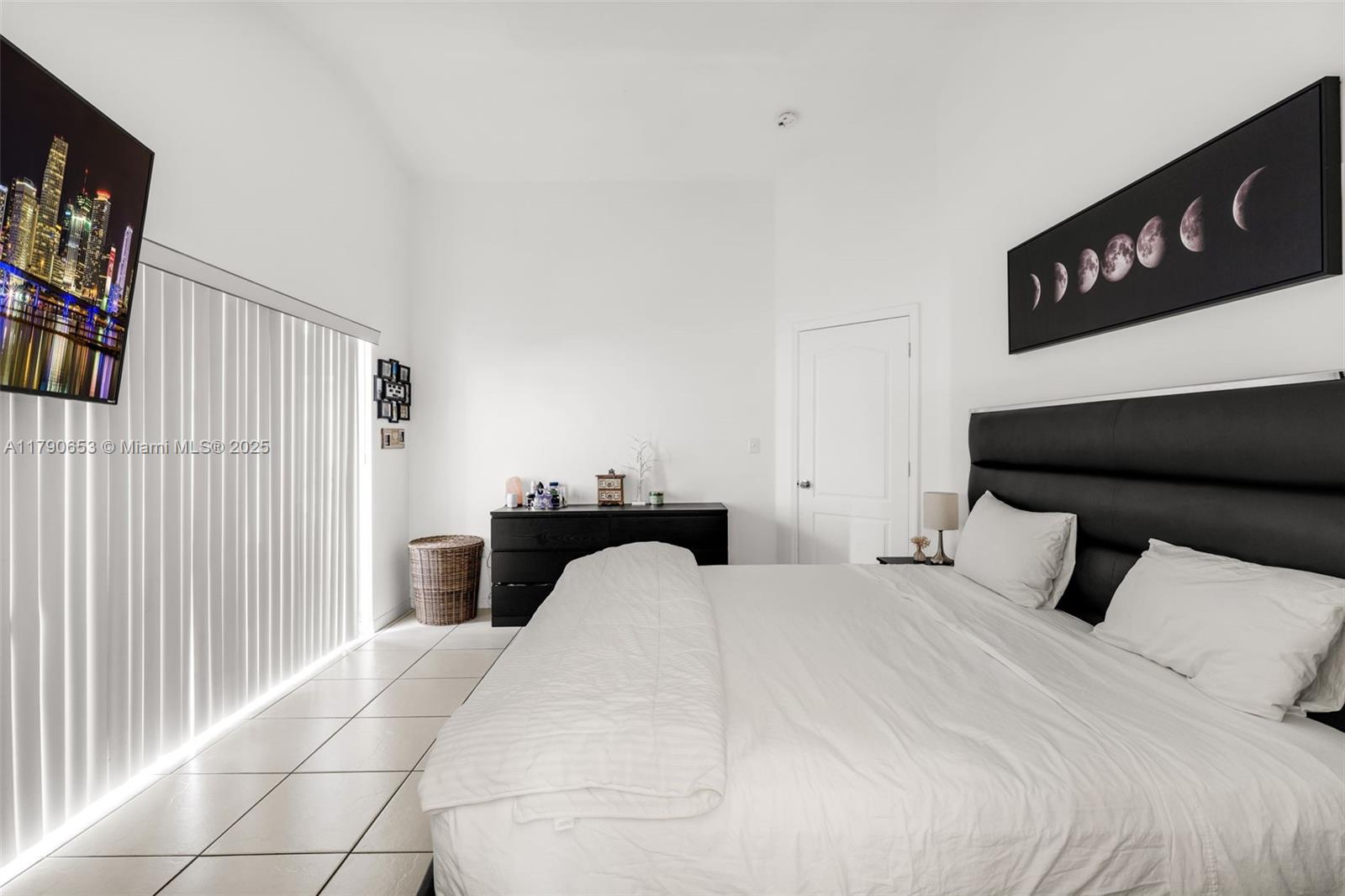 17834 Southwest 144th Court Miami, FL 33177 - Photo 9 of 23 a bedroom with a bed and a television
