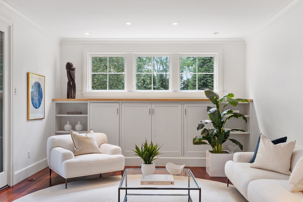 168 Nashawtuc Road Concord, MA 01742 - Photo 18 of 42 a living room with furniture and a potted plant