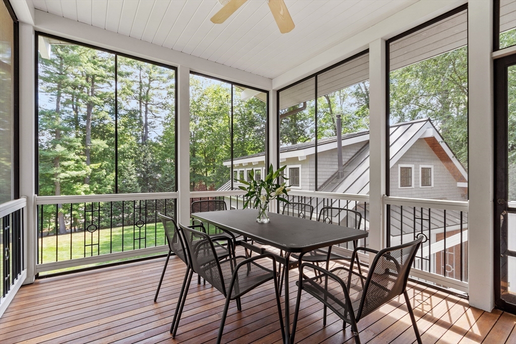 168 Nashawtuc Road Concord, MA 01742 - Photo 20 of 42 a view of a dining room with furniture window and wooden floor