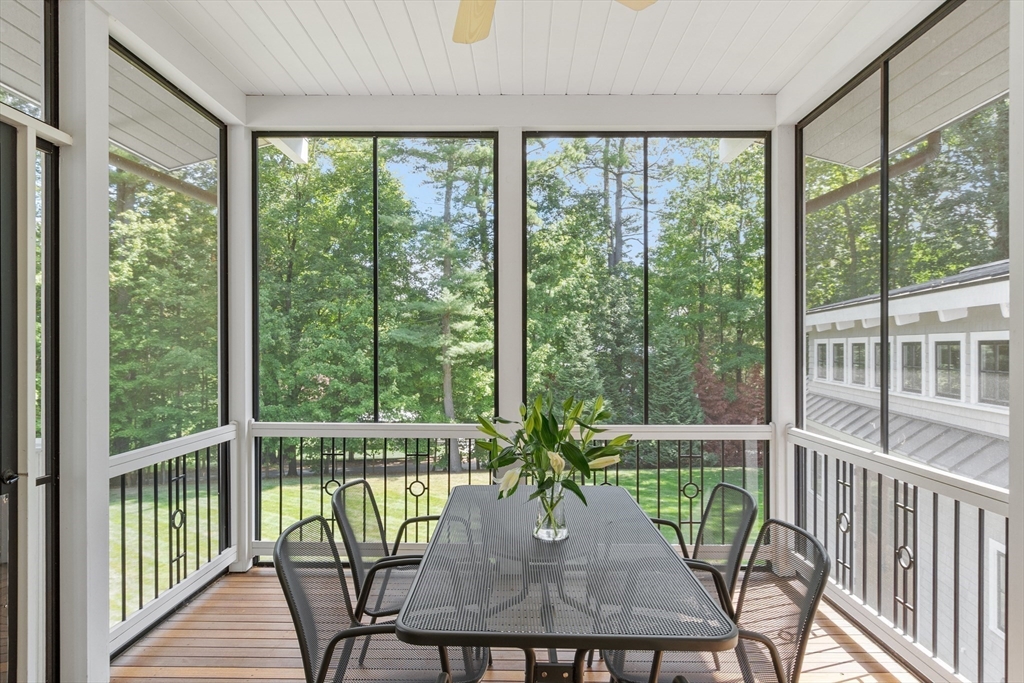 168 Nashawtuc Road Concord, MA 01742 - Photo 21 of 42 a view of a room with a furniture and balcony