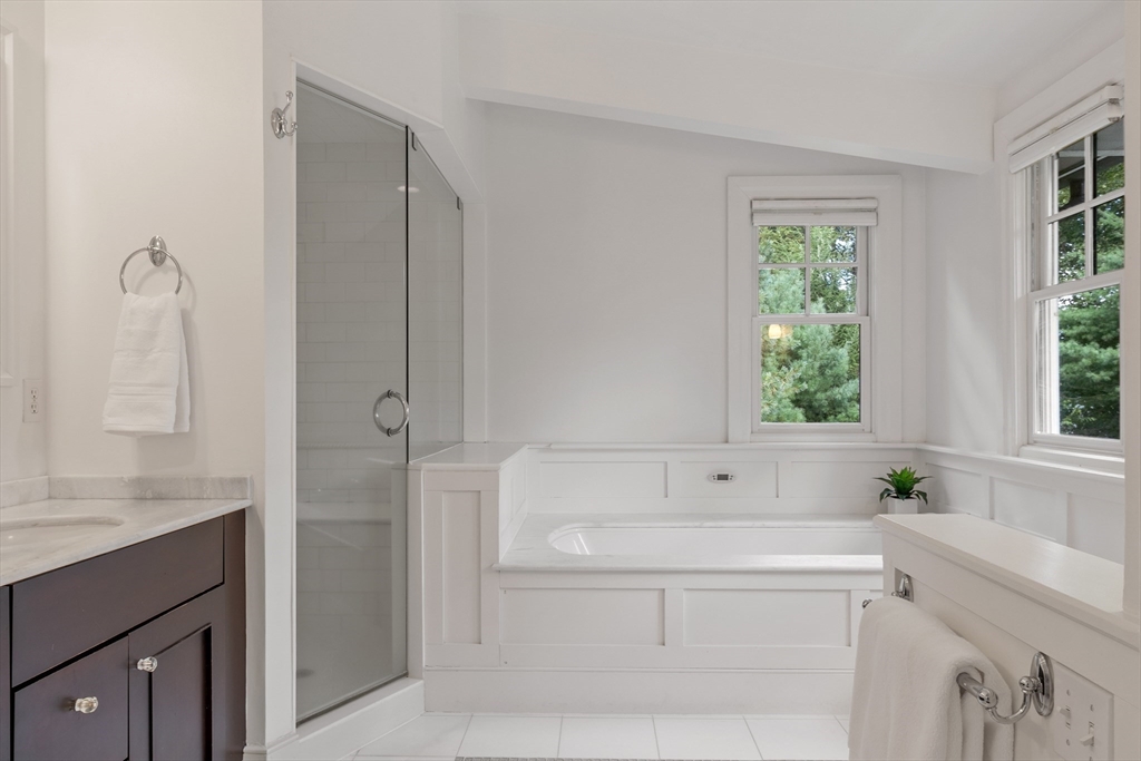 168 Nashawtuc Road Concord, MA 01742 - Photo 27 of 42 a bathroom with a bathtub and a sink