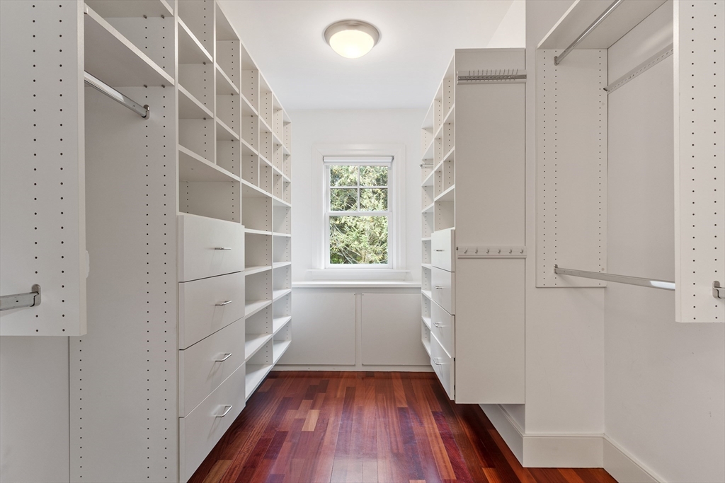 168 Nashawtuc Road Concord, MA 01742 - Photo 29 of 42 a view of walk in closet with wooden floor and entryway