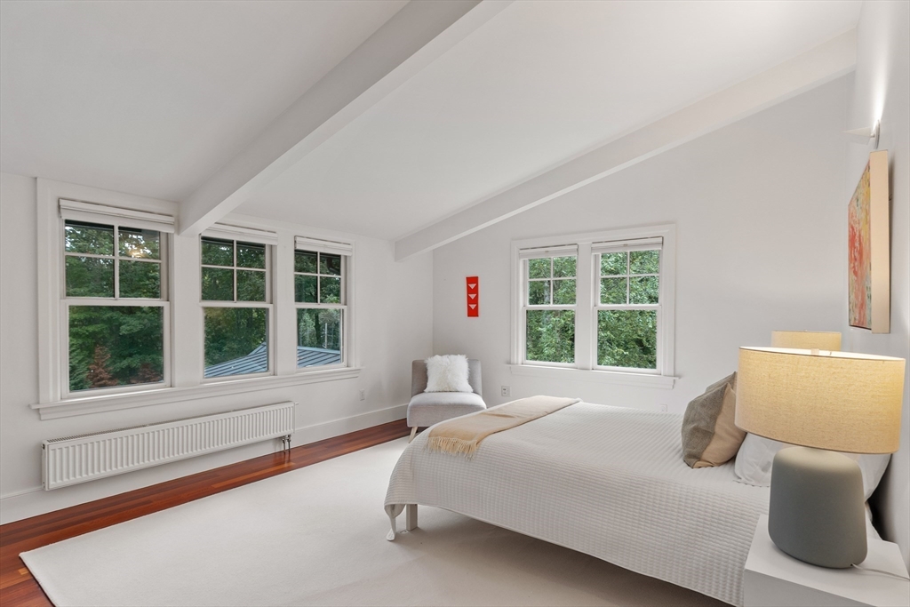 168 Nashawtuc Road Concord, MA 01742 - Photo 30 of 42 a bedroom with a bed and a large window