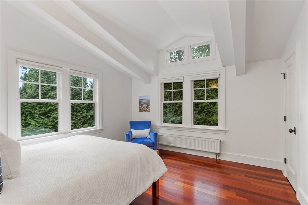 168 Nashawtuc Road Concord, MA 01742 - Photo 33 of 42 a view of a bedroom with wooden floor and windows