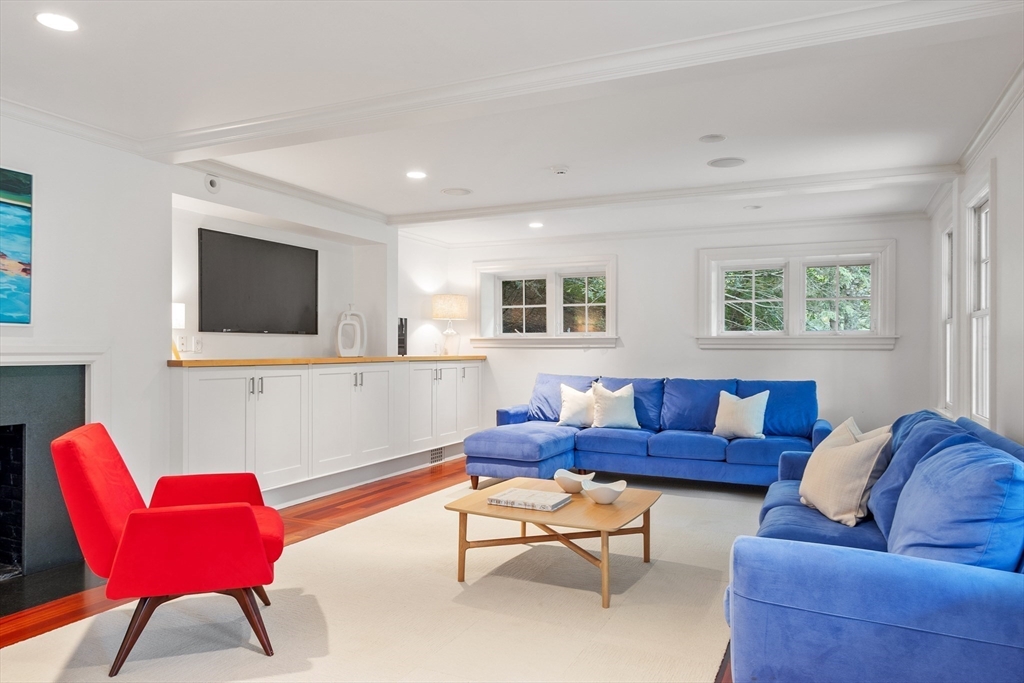 168 Nashawtuc Road Concord, MA 01742 - Photo 36 of 42 a living room with furniture and a flat screen tv