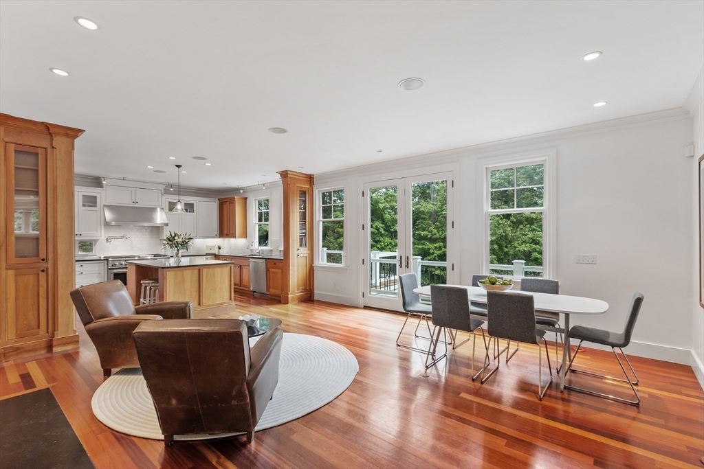168 Nashawtuc Road Concord, MA 01742 - Photo 10 of 42 a dining room with furniture and wooden floor