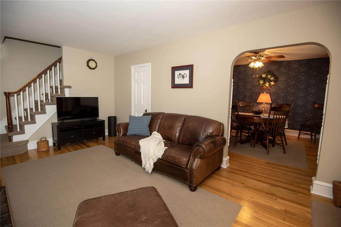 706 Stones Crossing Road Easton, PA 18045 - Photo 8 of 40 Natural light illuminates rich red oak hardwood flooring. A nice wide archway leads to the formal dining room.