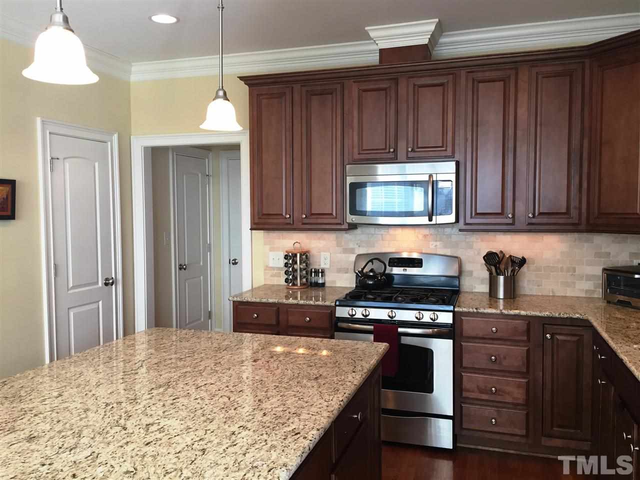 1307 Ileagnes Road Raleigh, NC 27603 - Photo 12 of 24 Huge island (6'x4') with overhang for bar stools. Plenty of lighting - pendants over island, 6 can lights, and under cabinet lighting. Kitchen also features two large pantries.
