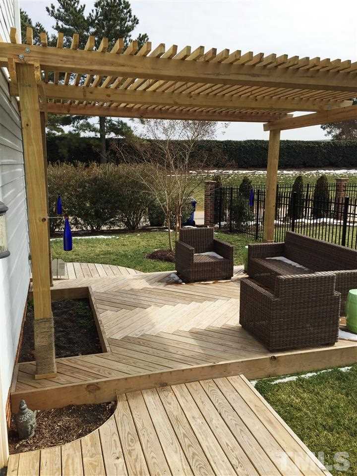 1307 Ileagnes Road Raleigh, NC 27603 - Photo 4 of 24 This custom built deck and pergola would be a great place for entertaining. It also features a planting area for vegetables or flowers.