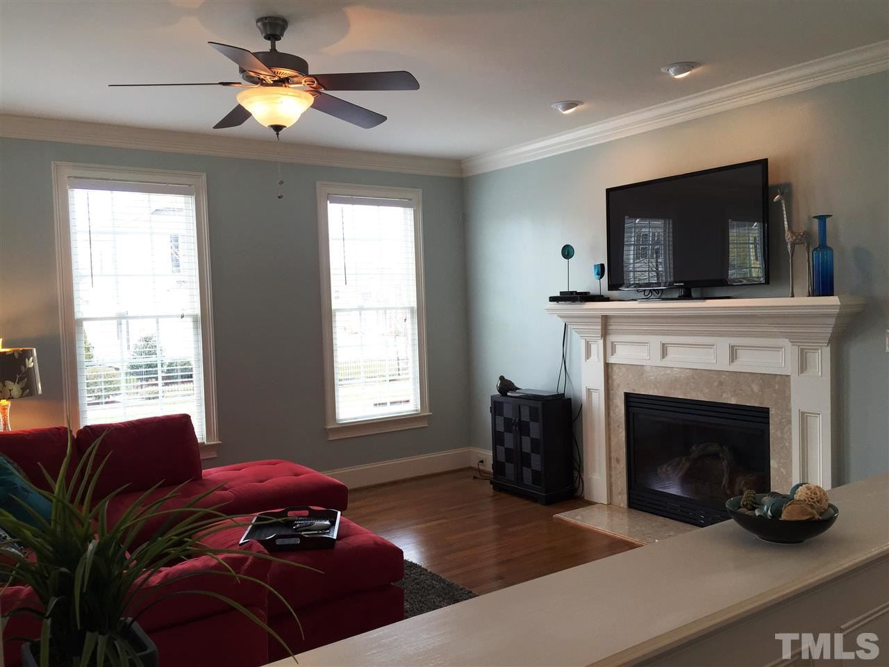 1307 Ileagnes Road Raleigh, NC 27603 - Photo 7 of 24 Another view of the large family room. Direct vent gas fireplace has custom mantle and accent lighting.