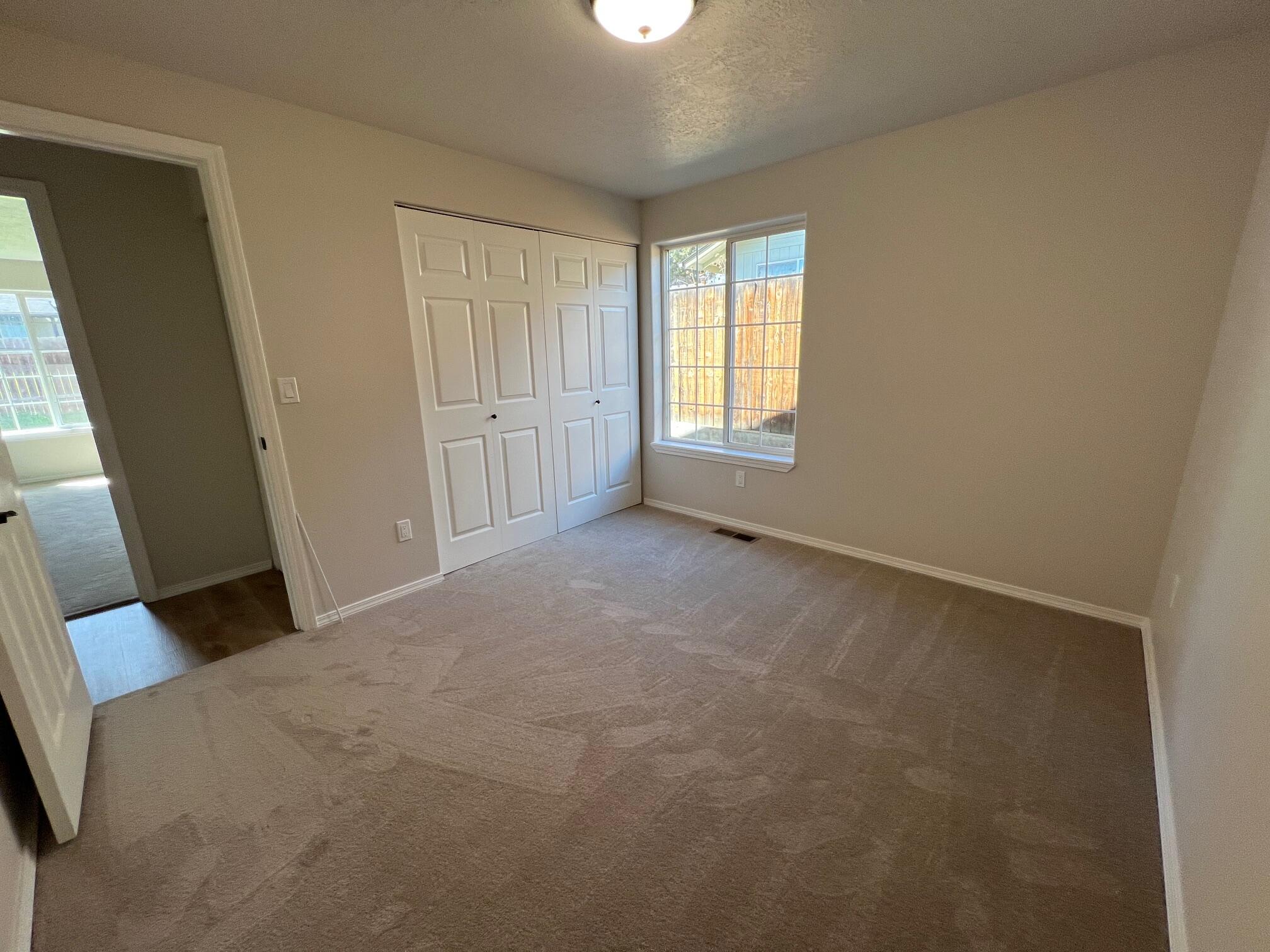 629 Deer Ridge Court Madras, OR 97741 - Photo 21 of 39 a view of an empty room with a window
