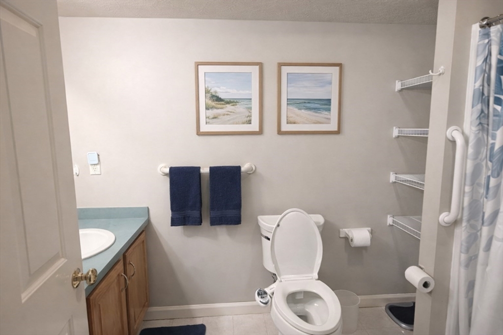 7 Conant Road, Unit 21 Winchester, MA 01890 - Photo 11 of 27 a bathroom with a toilet and a sink