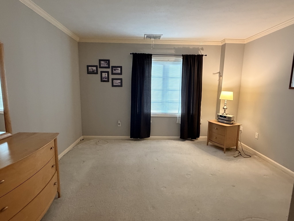 7 Conant Road, Unit 21 Winchester, MA 01890 - Photo 13 of 27 an empty room with windows